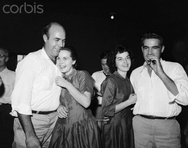 Roy Bryant (left), smokes a cigar as his wife happily embraces him. His half brother, J.W. Milam and his wife show jubilation. Bryant and Milam were cleared by an all white, male jury of the charge of having murdered Till, a 14-year-old Chicago boy who was black. The jury was out just one hour and 7 minutes. 