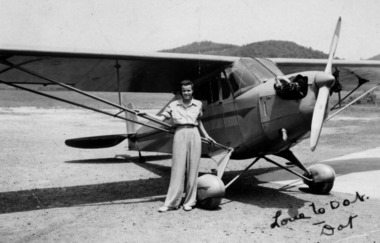 Dorothy Layne McIntyre next to her single-engine Piper Cub at West Virginia State College in 1940. She was a member of the Tuskegee airman. the slug is L07air.  07Lair
